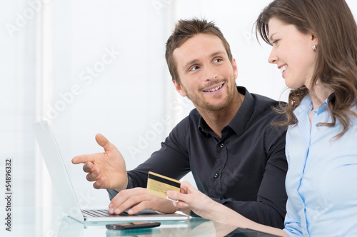 Photo: Young Couple Shopping Online Young Couple Shopping Online