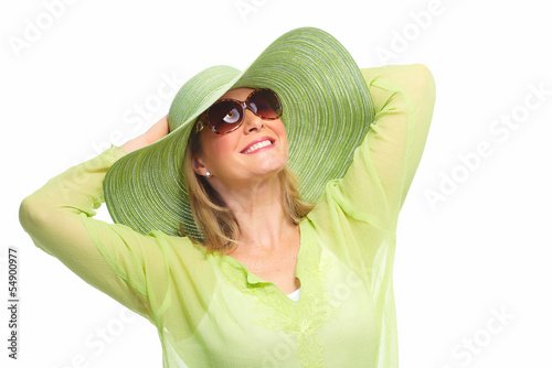 Photo: Woman wearing sunglasses and a hat. Woman wearing sunglasses and a hat.