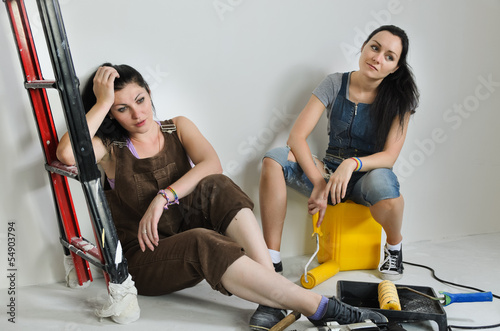 Photo: Exhausted women taking a break from renovating Exhausted women taking a break from renovating