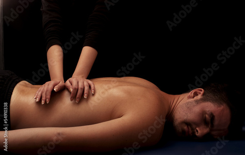 Photo: Man getting a back massage Man getting a back massage