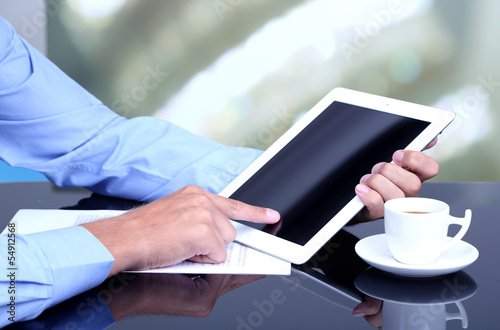 Photo: Businessman with notebook close-up Businessman with notebook close-up