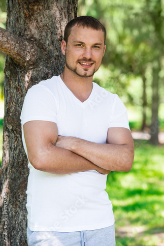 Photo: Handsome man in the park Handsome man in the park