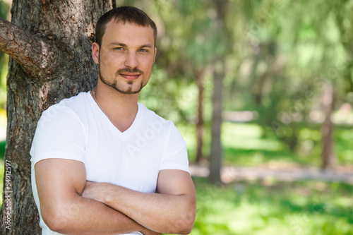 Photo: Outdoor portrait of a good looking young man Outdoor portrait of a good looking young man