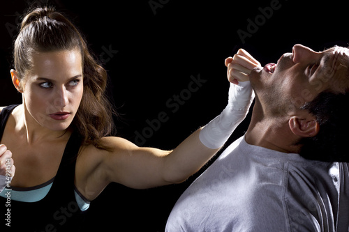 Photo: female MMA fighter fighting a man female MMA fighter fighting a man
