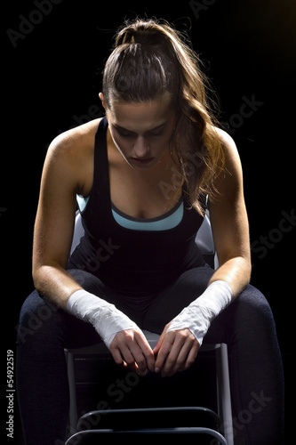 Photo: female MMA fighter sitting female MMA fighter sitting