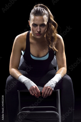 Photo: female MMA fighter sitting female MMA fighter sitting