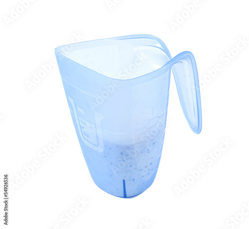 Photo: washing powder in a measuring cup washing powder in a measuring cup