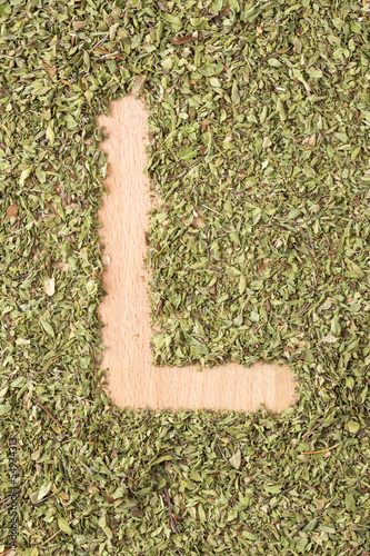 Photo: Letter L written with oregano Letter L written with oregano