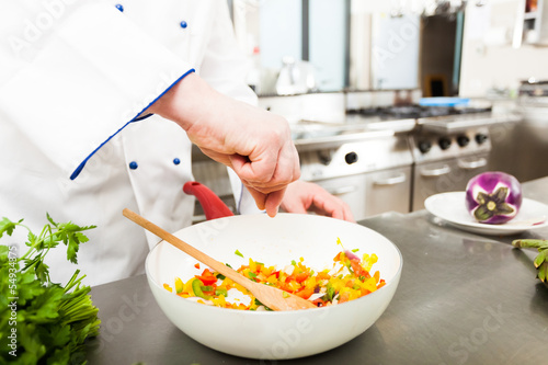 Photo: Chef spicing food Chef spicing food