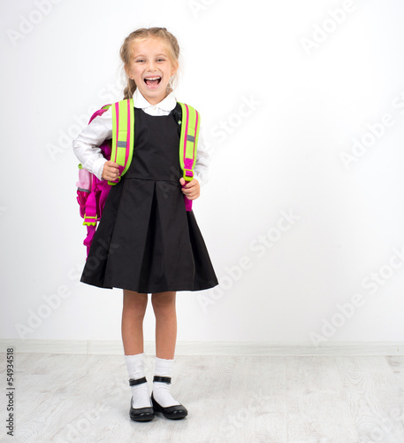 Photo: little cute girl with a backpack little cute girl with a backpack