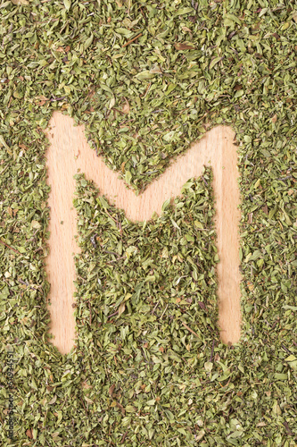 Photo: Letter M written with oregano Letter M written with oregano