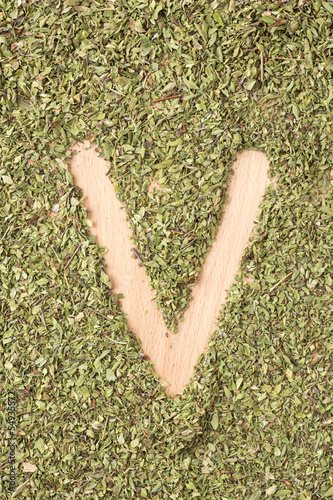 Photo: Letter V written with oregano Letter V written with oregano
