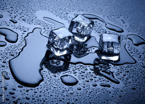 Photo: Ice cubes over dark background Ice cubes over dark background