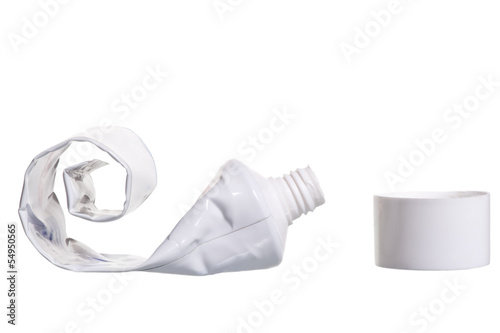 Photo: empty cosmetic tube with the lid open on a white background empty cosmetic tube with the lid open on a white background