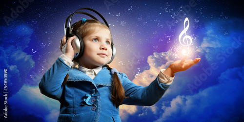 Photo: Little girl in headphones Little girl in headphones
