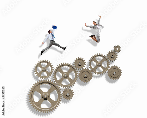 Photo: Business people and mechanism elements Business people and mechanism elements