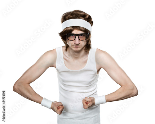 Photo: Funny retro nerd flexing his muscle isolated on white background Funny retro nerd flexing his muscle isolated on white background