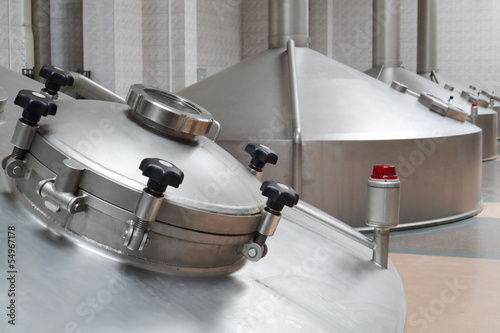 Photo: Big metal cisterns for beer in factory Big metal cisterns for beer in factory