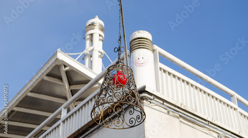 Photo: building hung brass squirm lampshade red light building hung brass squirm lampshade red light