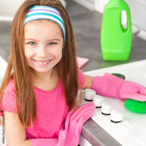 Photo: girl make cleaning in the kitchen girl make cleaning in the kitchen