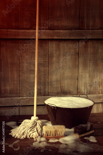 Photo: Cleaning mop and bucket with wet soapy floor Cleaning mop and bucket with wet soapy floor