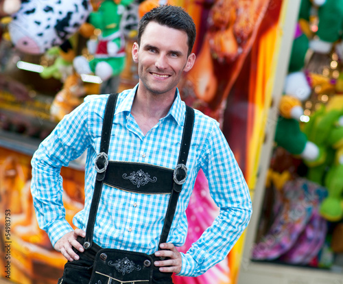 Photo: Young man wearing traditional Bavarian Lederhosen Young man wearing traditional Bavarian Lederhosen