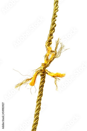 Photo: Torn golden rope on white Torn golden rope on white