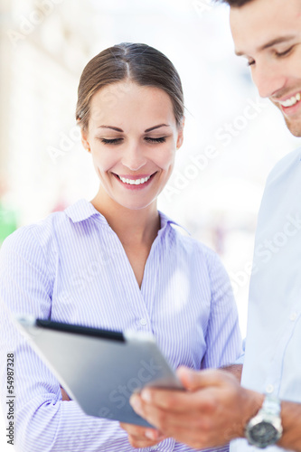 Photo: Business people with digital tablet Business people with digital tablet