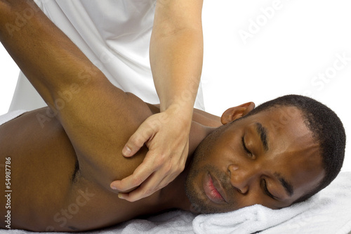 Photo: young female therapist helping young male patient young female therapist helping young male patient