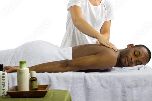 Photo: masseuse showing off spa products for men masseuse showing off spa products for men