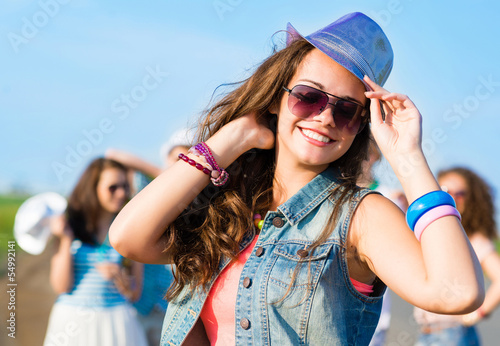 Photo: stylish young woman in sunglasses stylish young woman in sunglasses