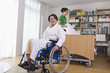 Photo: Deutschland, Leipzig, ältere Frau, Seniorin sitzt im Rollstuhl, eine andere Frau macht die Betten Deutschland, Leipzig, ältere Frau, Seniorin sitzt im Rollstuhl, eine andere Frau macht die Betten