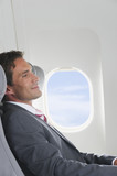 Photo: Deutschland, Bayern, München, Geschäftsmann Entspannung in der Business Class Flugzeugkabine Deutschland, Bayern, München, Geschäftsmann Entspannung in der Business Class Flugzeugkabine