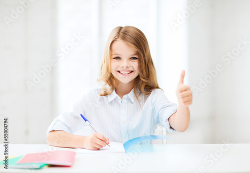 Photo: student girl studying at school student girl studying at school