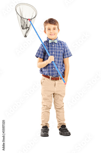 Photo: Full length portrait of a kid holding a butterfly net Full length portrait of a kid holding a butterfly net