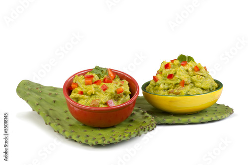Photo: Guacamole on green cactus leaf. Guacamole on green cactus leaf.