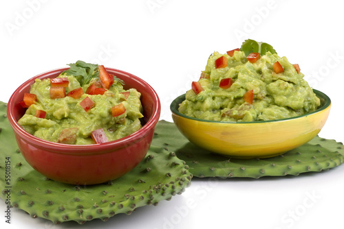 Photo: Guacamole on green cactus leaf. Guacamole on green cactus leaf.
