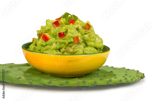 Photo: Guacamole on green cactus leaf. Guacamole on green cactus leaf.