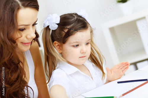 Photo: Mother and daughter studying Mother and daughter studying