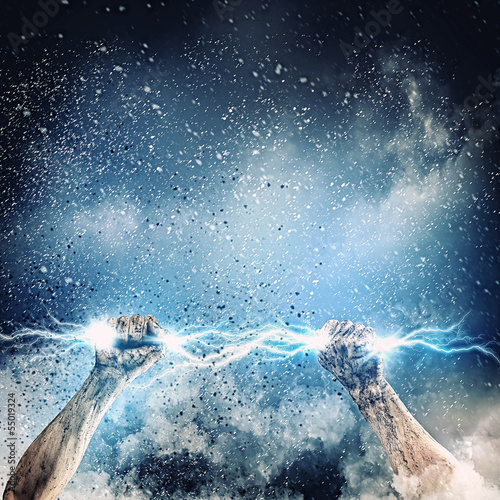 Photo: Human hand holding lightning Human hand holding lightning