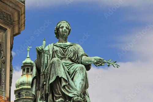 Photo: Statue with olive branch and a sword Statue with olive branch and a sword