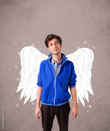 Photo: Cute person with angel illustrated wings on grungy background Cute person with angel illustrated wings on grungy background