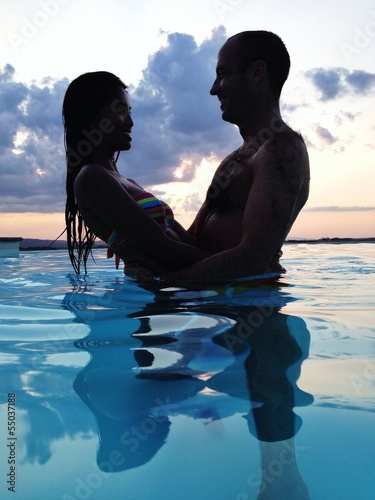 Instant Collection: couple at dusk in water couple at dusk in water