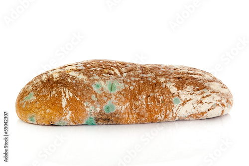 Photo: Mold on bread. Mouldy bread, isolated on a white background Mold on bread. Mouldy bread, isolated on a white background