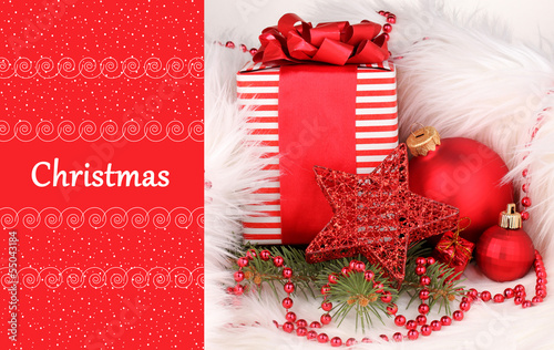 Photo: Christmas gift and red Christmas balls in white fur Christmas gift and red Christmas balls in white fur