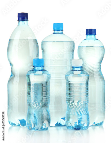Photo: Bottles of water, isolated on white Bottles of water, isolated on white