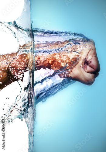 Photo: Male Fist Hitting Water Male Fist Hitting Water