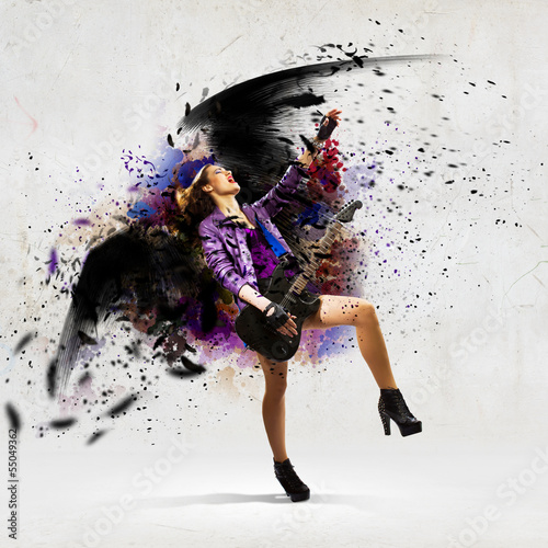Photo: Rock passionate girl with black wings Rock passionate girl with black wings