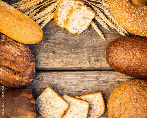 Photo: Homemade bread and wheat on the wooden table Homemade bread and wheat on the wooden table