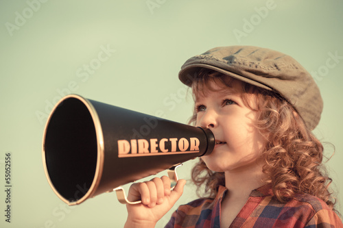 Photo: Kid shouting through megaphone Kid shouting through megaphone